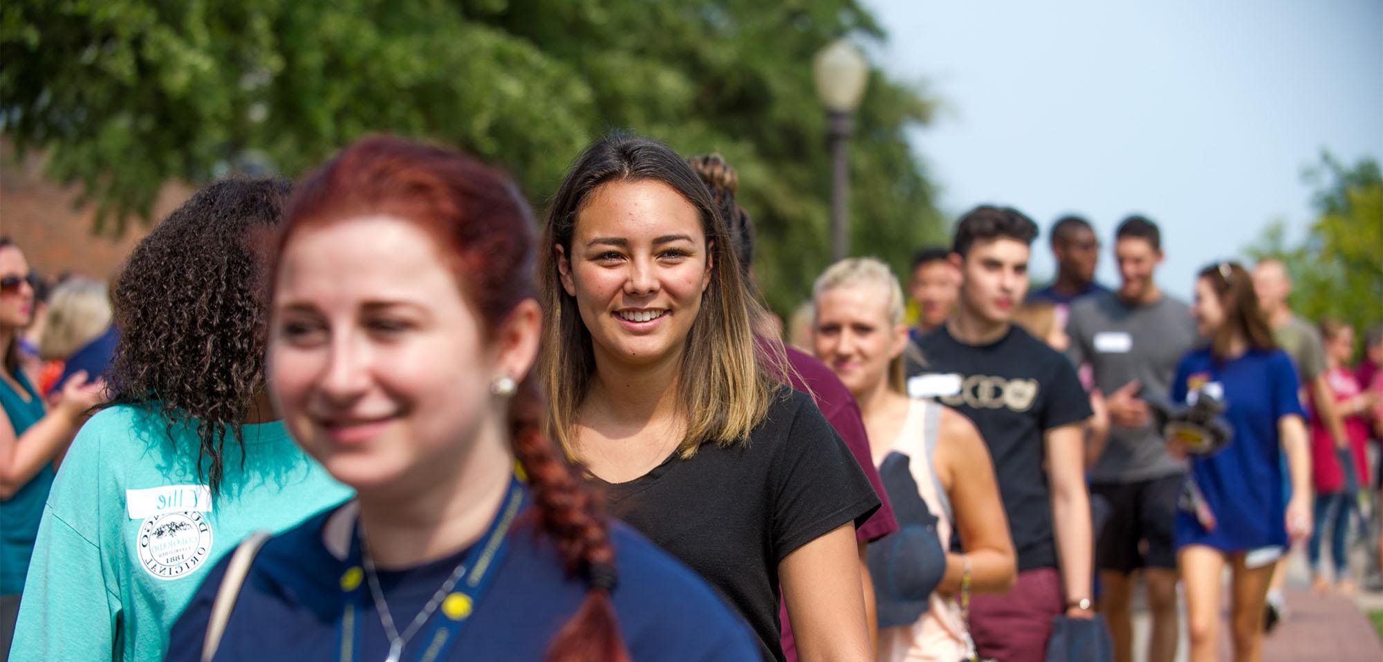 A group of students walking down.